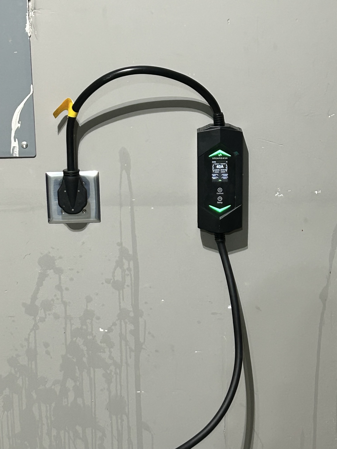 Plug-in EV charging equipment connected to wall receptacle