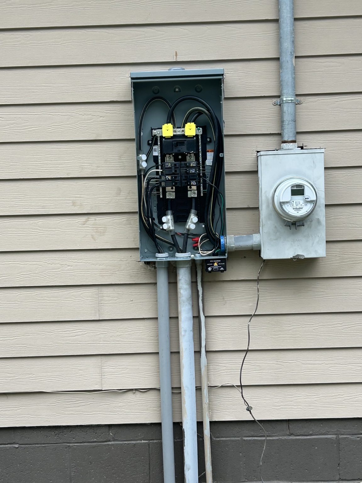 Outdoor electrical panel and meter installation