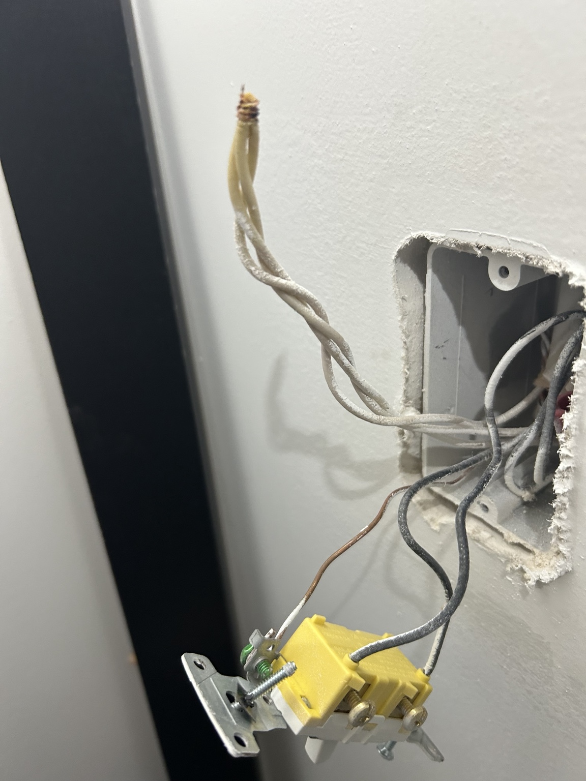 Damaged electrical wiring at switch box